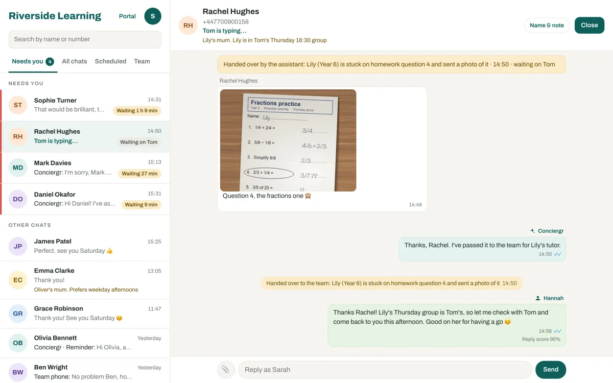 A chat in the Team Inbox where an invented parent sends a photo of her daughter's fractions worksheet. A banner says the assistant handed it over and it is waiting on Tom; Hannah's holding reply, saying she will check with Tom, shows a 90% score.